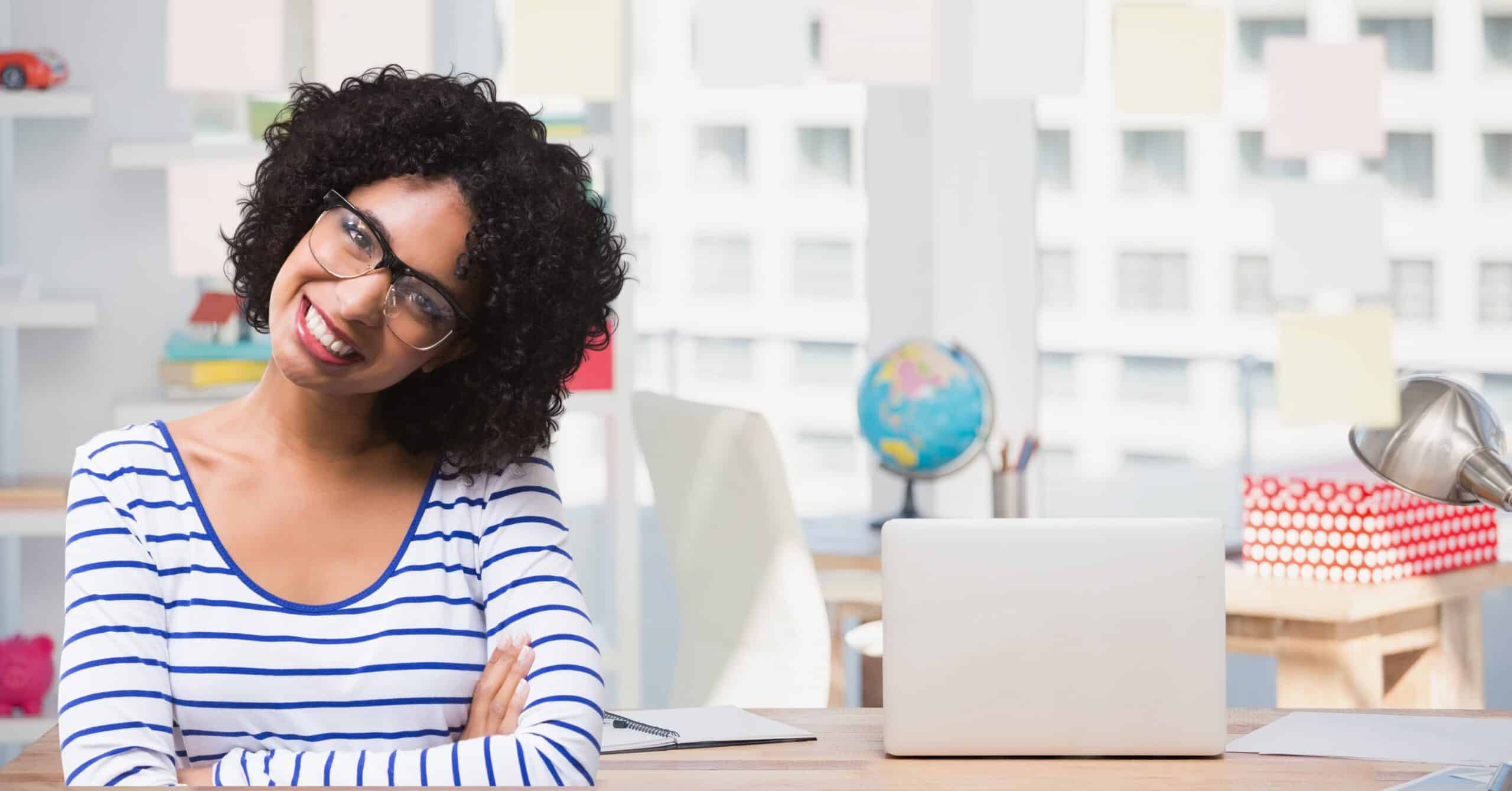 woman in spectacles smiling against school background