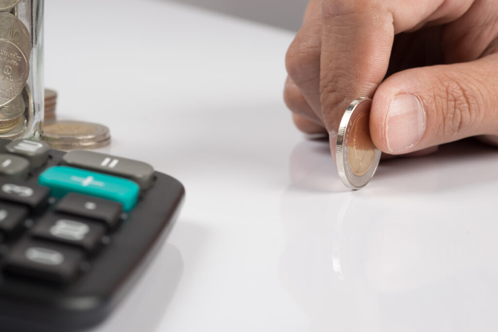 human hand holding an coin and copy space, business investment p